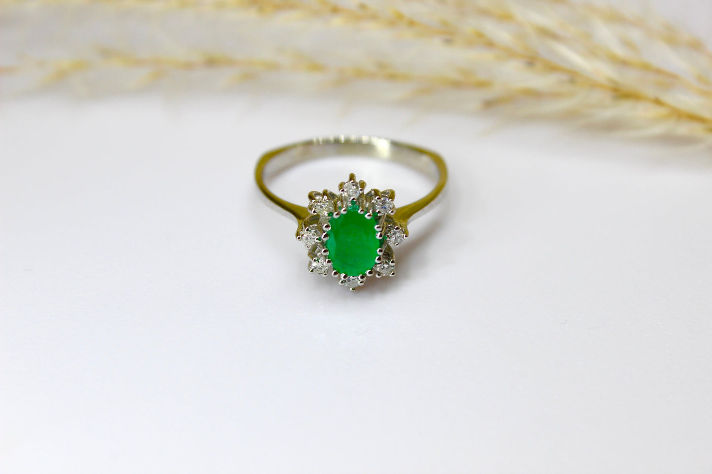 Vintage emerald ring in 14K white gold surrounded by octagon cut diamonds