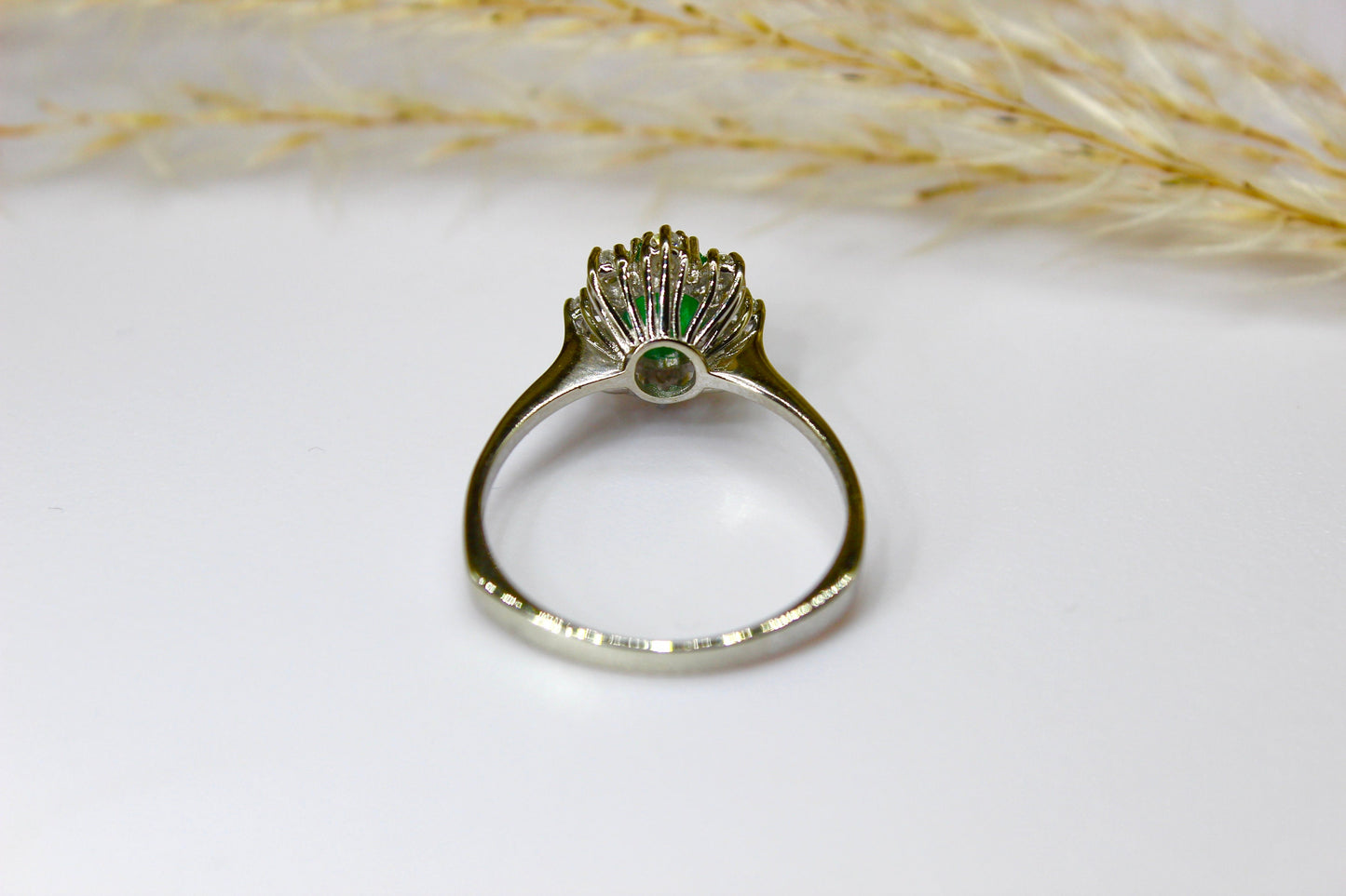 Vintage emerald ring in 14K white gold surrounded by octagon cut diamonds