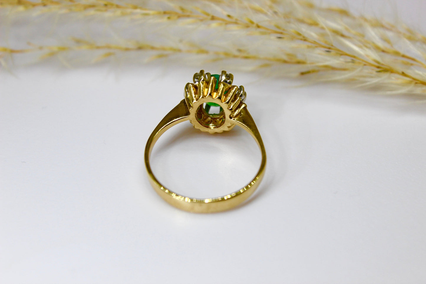 Vintage emerald ring in 14K yellow gold surrounded by octagon cut diamonds