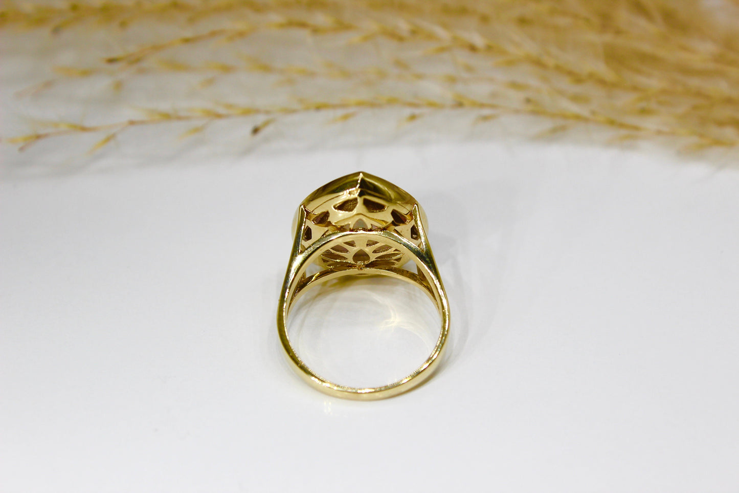 Opal drops in 14K yellow gold surrounded by zirconia stones in bezel setting