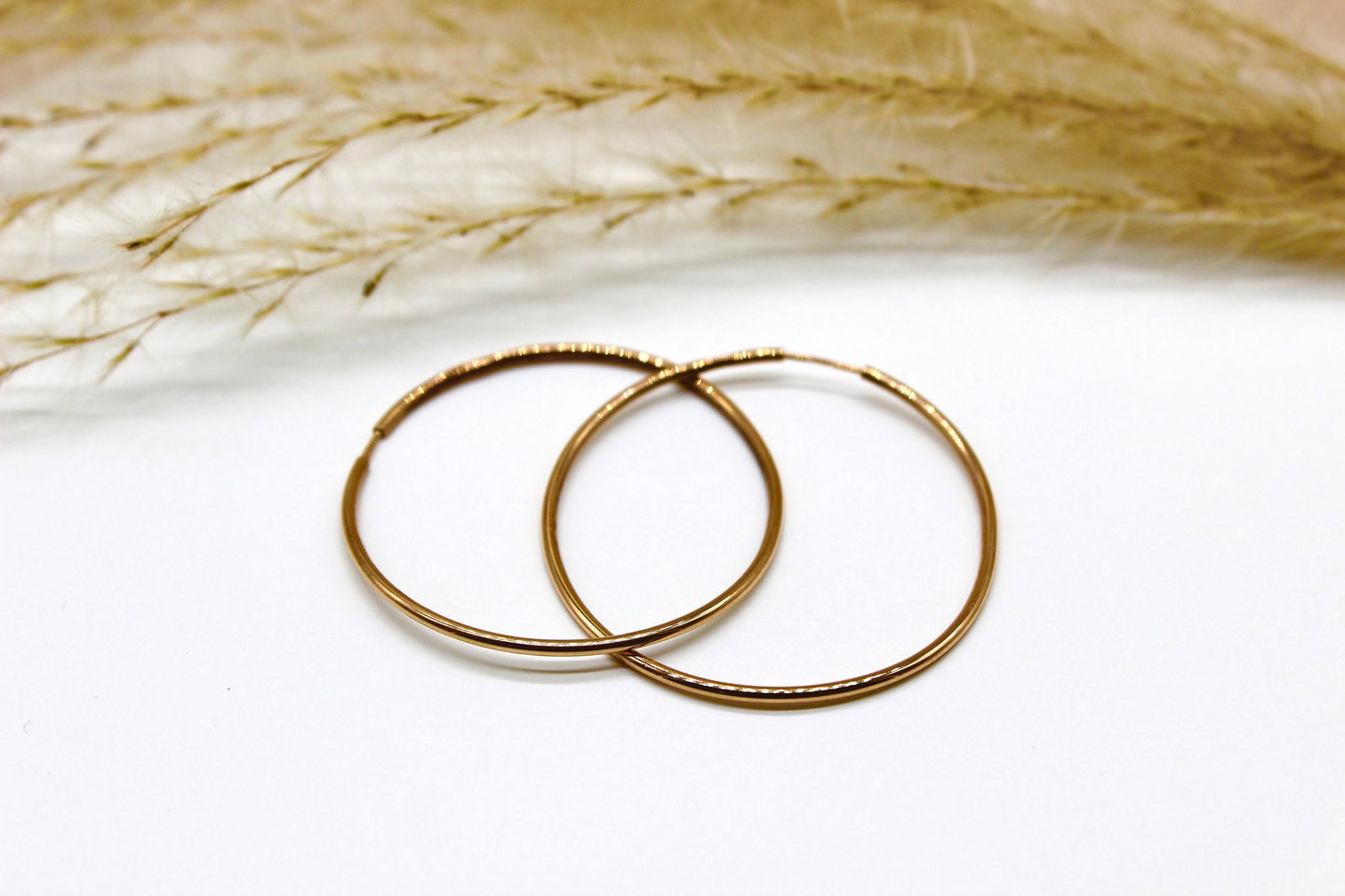 Schlichte Abgerundete Creolen in 14K Rotgold fein