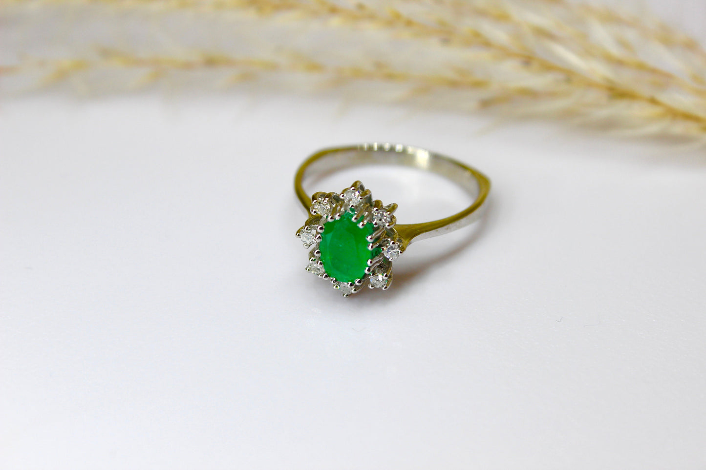 Vintage emerald ring in 14K white gold surrounded by octagon cut diamonds